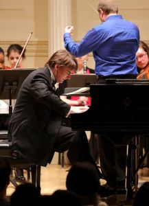 Grzegorz Niemczuk performs Chopin's Piano Concerto in F Minor at his Carnegie Hall debut with the New York Concerti Sinfonietta. He is the winner of the 2013 International Concerto Competition. (Photo by Kexi Cao).